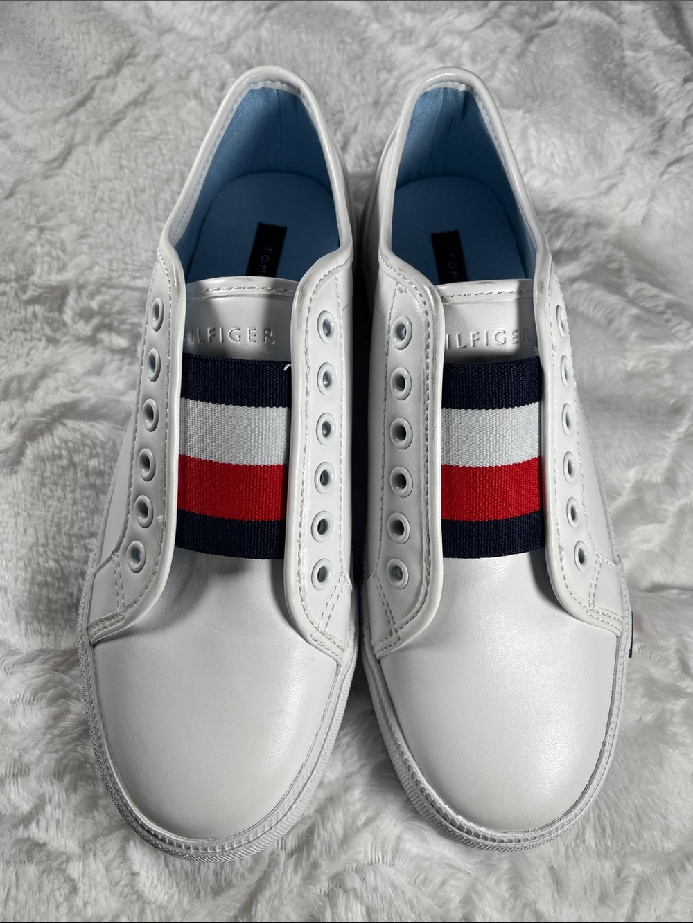 NEW. Tommy Hilfiger White Slip-On Sneakers with Navy and Red Stripe